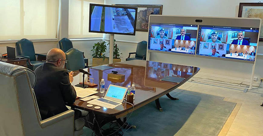 Prime Minister and Minister of Defence Omar Razzaz checks on the conditions of citizens in Irbid and the services being provided to them during a videoconference on Monday (Petra photo)